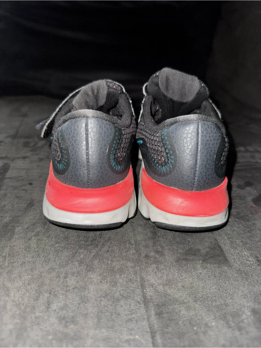 Renew Nike Kids size 13. Running Black Sneakers with Blue and neon pink .